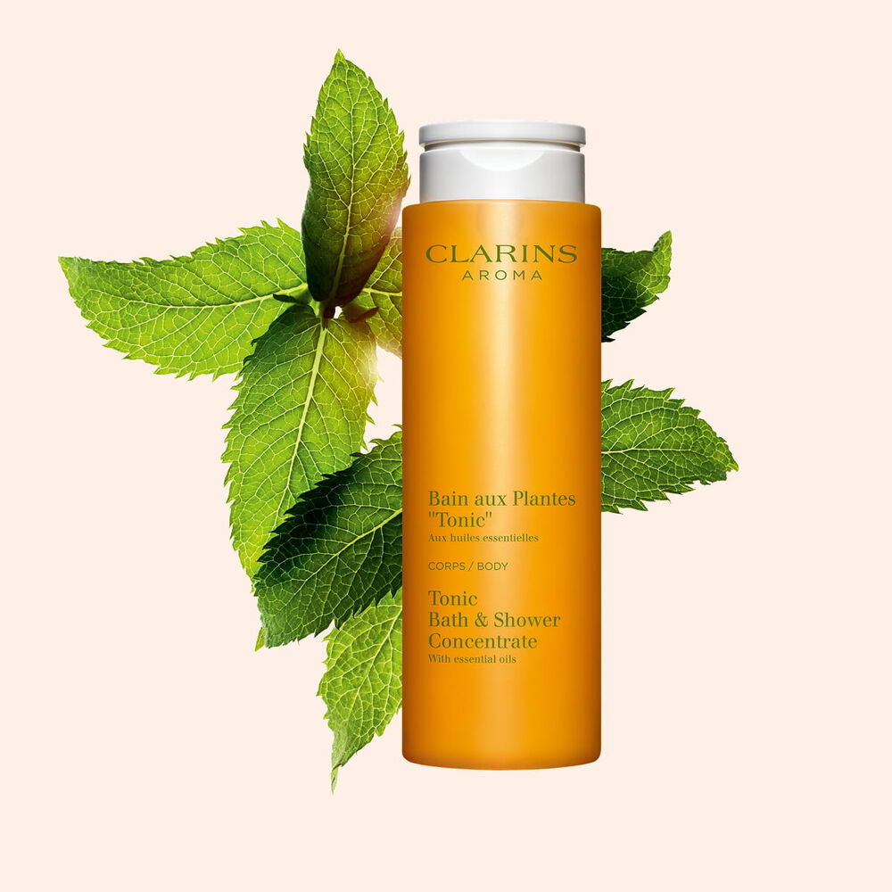 Clarins Tonic Bath & Shower Concentrate with essential oils for a gentle, invigorating cleanse to refresh body and mind.