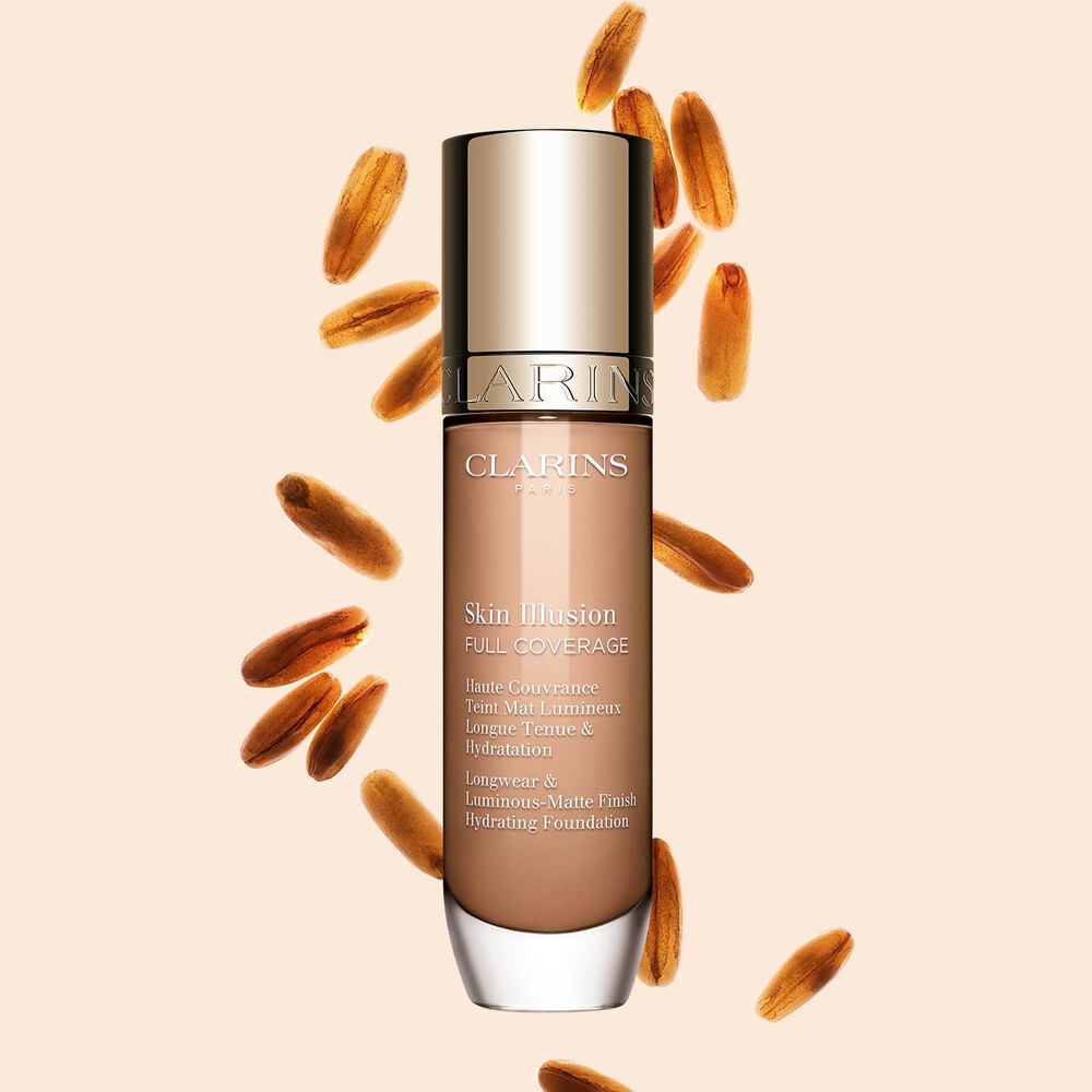 Clarins Skin Illusion Full Coverage showcasing its sleek design and vibrant packaging, the ideal foundation for a flawless & natural complexion.