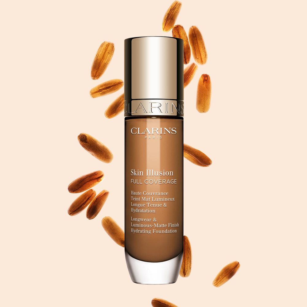 Clarins Skin Illusion Full Coverage showcasing its sleek design and vibrant packaging, the ideal foundation for a flawless & natural complexion.
