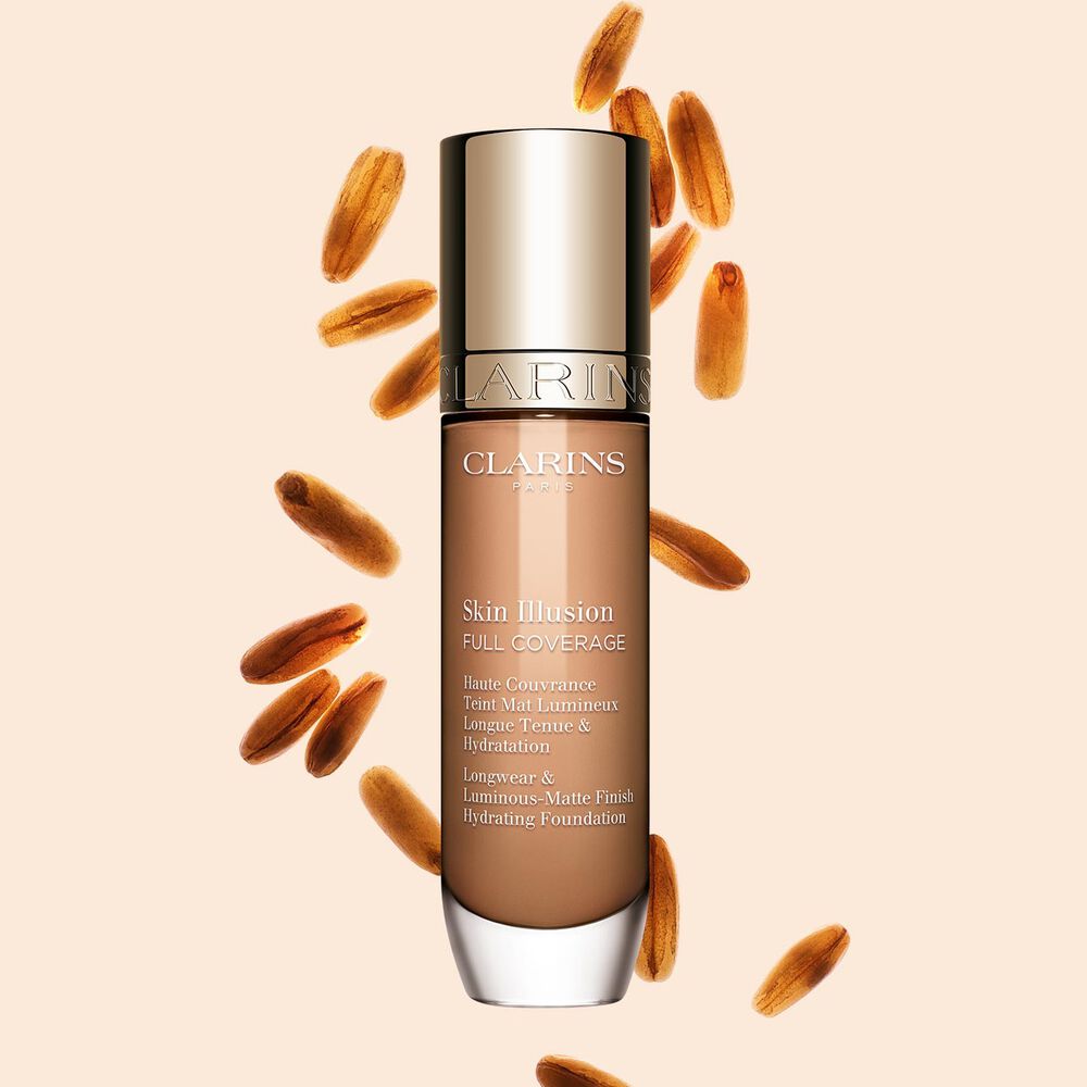 Clarins Skin Illusion Full Coverage showcasing its sleek design and vibrant packaging, the ideal foundation for a flawless & natural complexion.