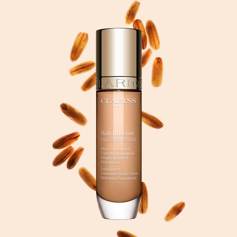 Clarins Skin Illusion Full Coverage showcasing its sleek design and vibrant packaging, the ideal foundation for a flawless & natural complexion.