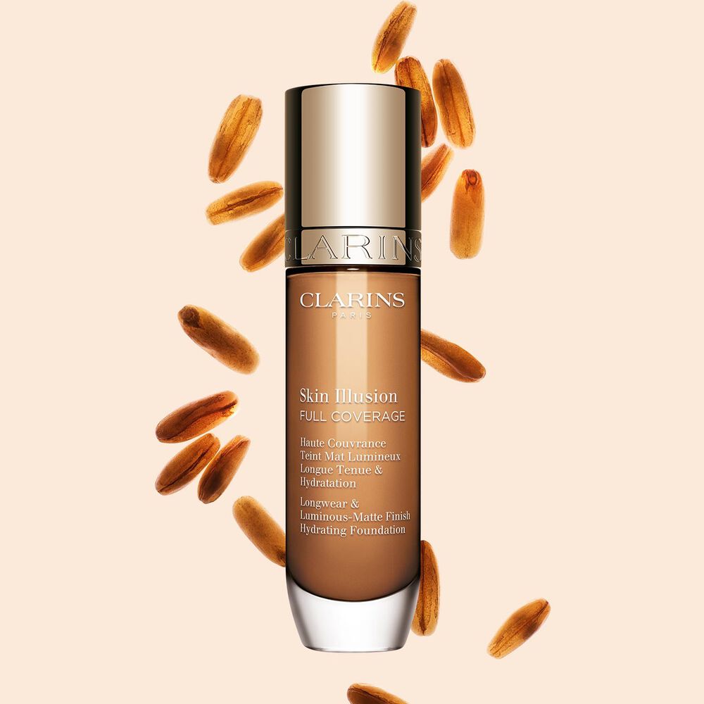 Clarins Skin Illusion Full Coverage showcasing its sleek design and vibrant packaging, the ideal foundation for a flawless & natural complexion.
