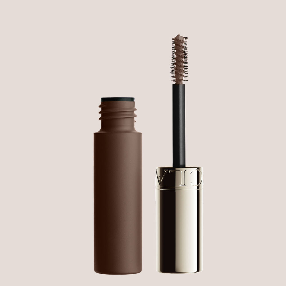 Packshot of Clarins Warm Brown Brow Gel, tinted to enhance warm-toned brows with a natural, defined, and polished finish.