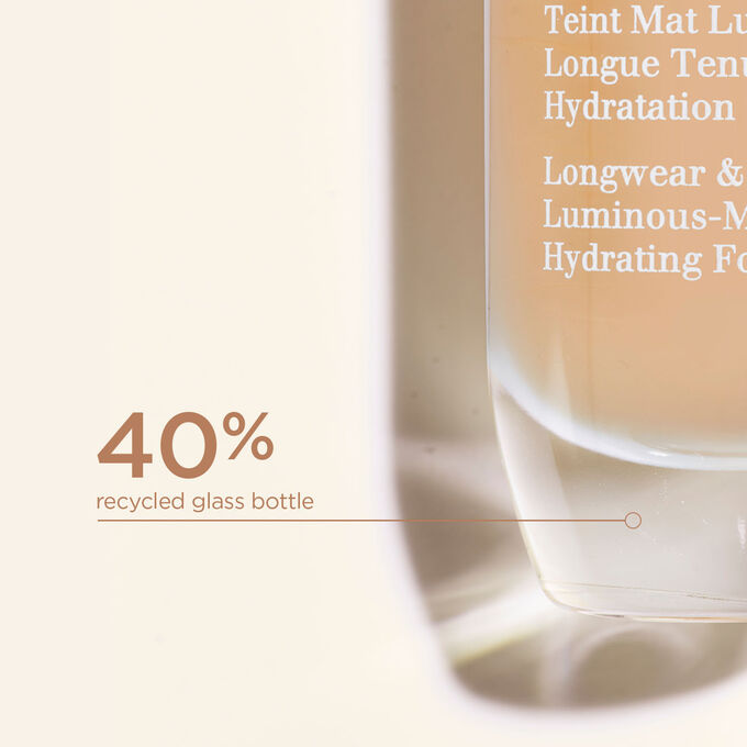 Clarins Skin Illusion Full Coverage foundation bottle made with 40% recycled glass, highlighting the brand's commitment to sustainable and eco-friendly packaging.