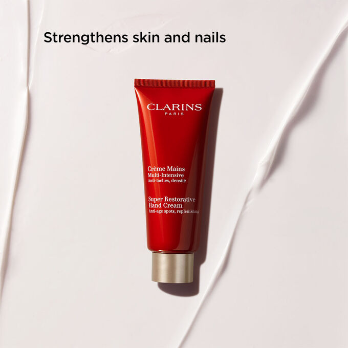 Packshot of Clarins Super Restorative Hand Cream, highlighting its tightening, firming, and wrinkle-smoothing benits.