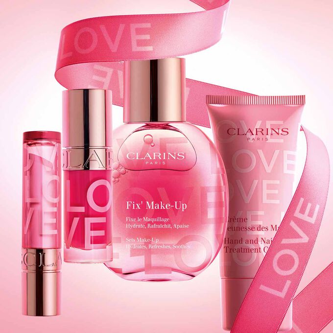 Limited edition Love Collection by Clarins, featuring a Lip Oil, Fix Make-Up, Lip Balm, and Hand Cream for a complete skincare experience