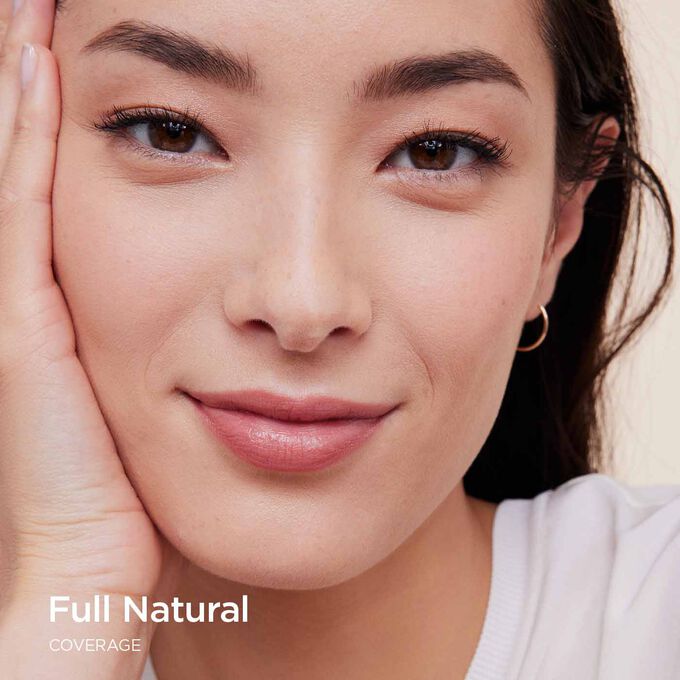 Woman wearing Clarins Skin Illusion Full Coverage foundation showcasing full coverage and natural result.