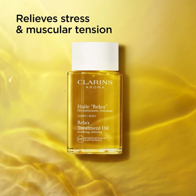 Packshot of Clarins Relax Body Treatment Oil on a textured background, with text emphasising the relaxing power of the product