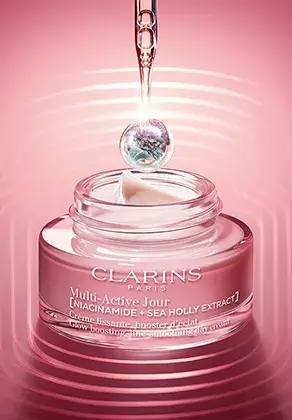 Multi-Active day cream packshot with a pipette and a drop