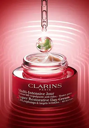 Super-Restorative day cream packshot with a pipette and a drop
